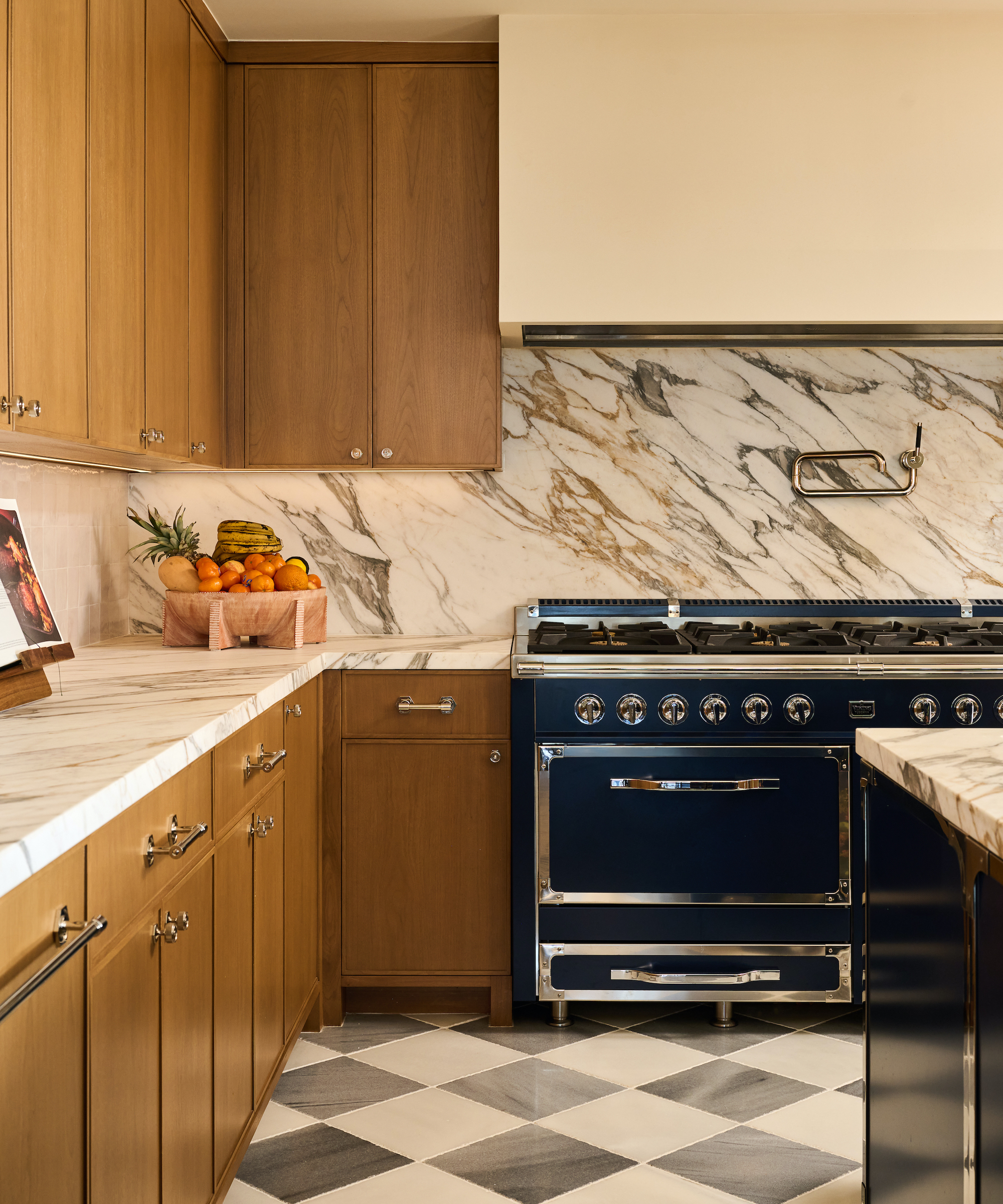 wood kitchen with marble and black range cooker