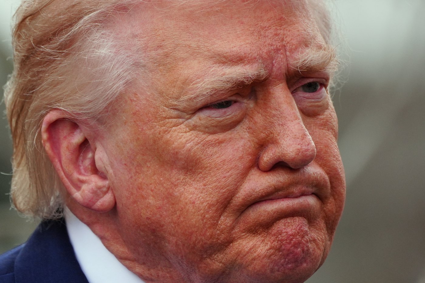President Donald Trump speaks with reporters before departing on Marine One from the South Lawn of the White House, Friday, March 20, 2026, in Washington. (AP Photo/Alex Brandon)