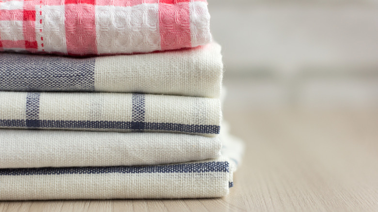 Keep kitchen towels off countertops with a smart sliding storage solution