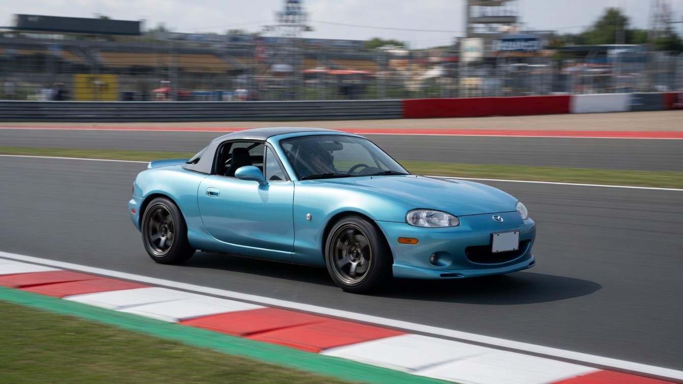 Turbocharged Mazda meets performance coupe on the track
