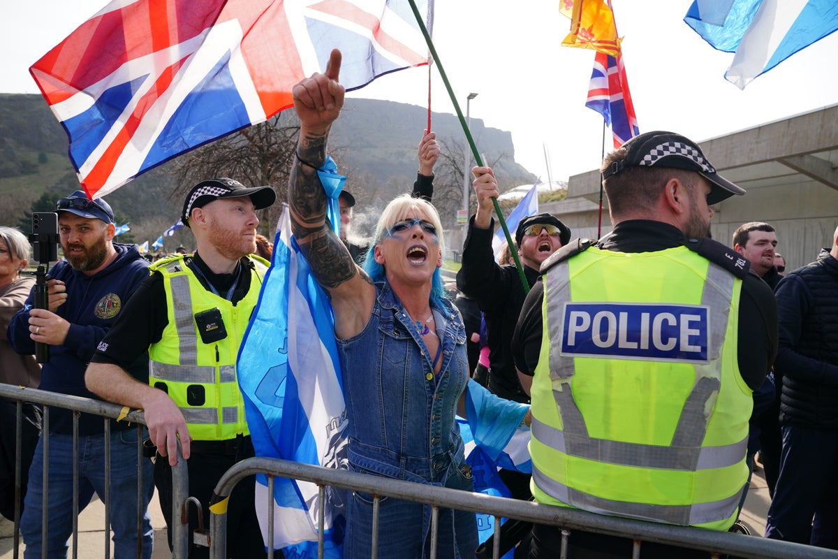 Police keep opposing groups apart as anti-immigration rally held at ...