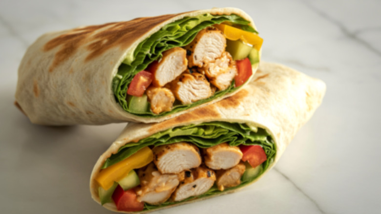 Which fast food chicken wrap has more protein, Wendy's or McDonald's?