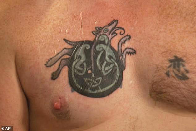 Elizabeth Warren backs candidate with Nazi-linked tattoo after blasting ...