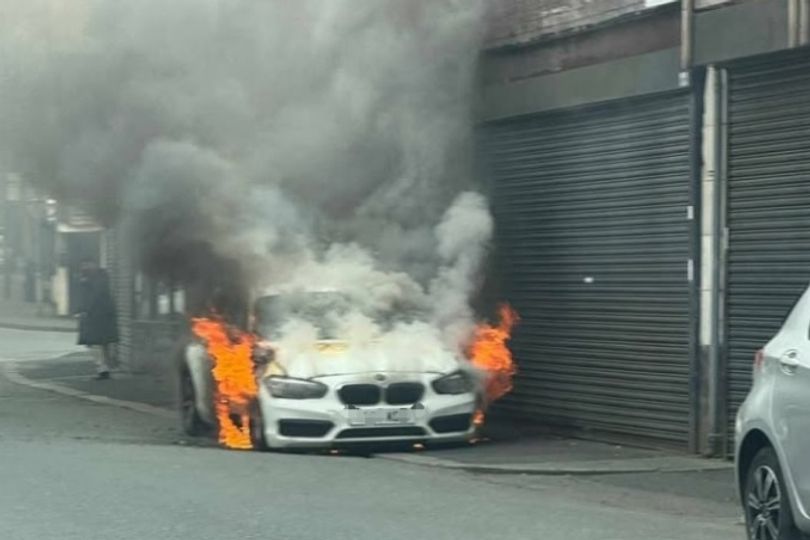 Road closed after car bursts into flames with driver behind the wheel