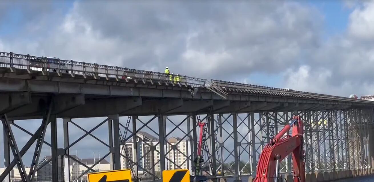 Bucket truck goes over side of Lake Charles bridge while trying to ...