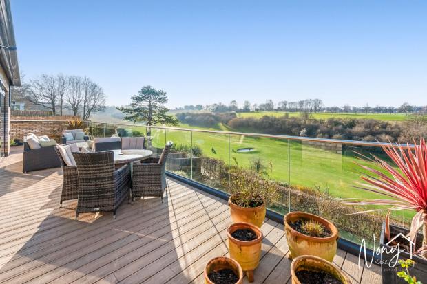 Flat with a balcony and views over golf course on the market for £875,000