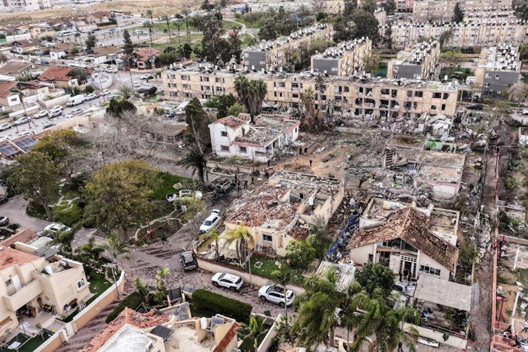A drone view shows a damage in a residential neighbourhood, following a night of Iranian missile strikes which injured dozens of Israelis, amid the U.S.-Israel conflict with Iran, in Dimona, southern Israel March 22, 2026. REUTERS/Roei Kastro