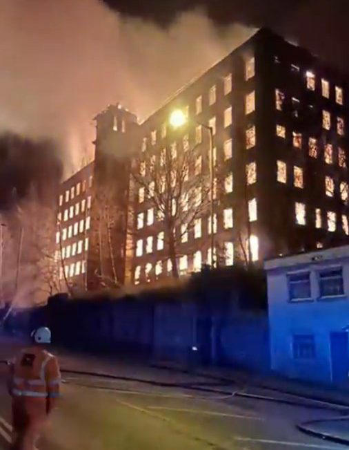 Flames light up sky after fire rips through historic Grade II building