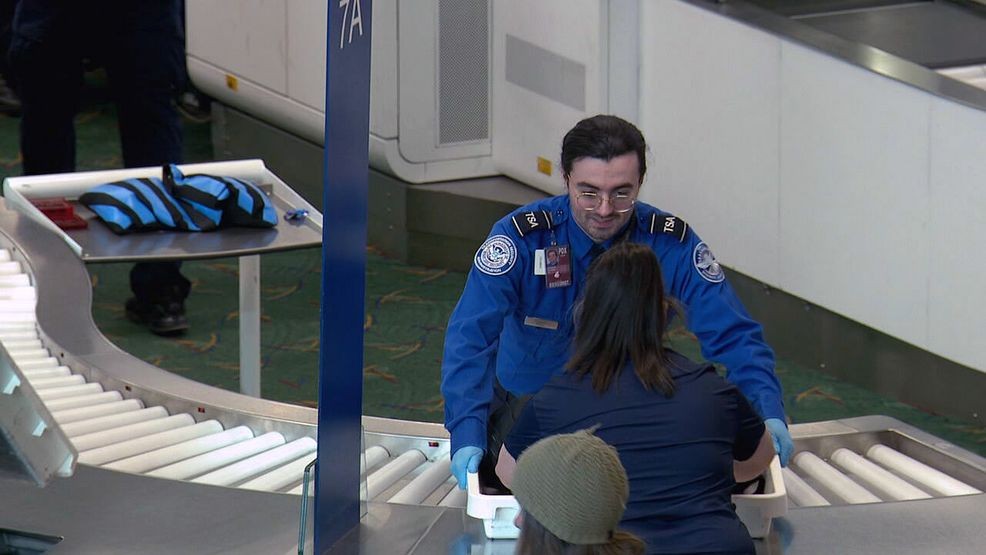 Portland International Airport TSA workers sleep in cars as they await pay on Monday<br>