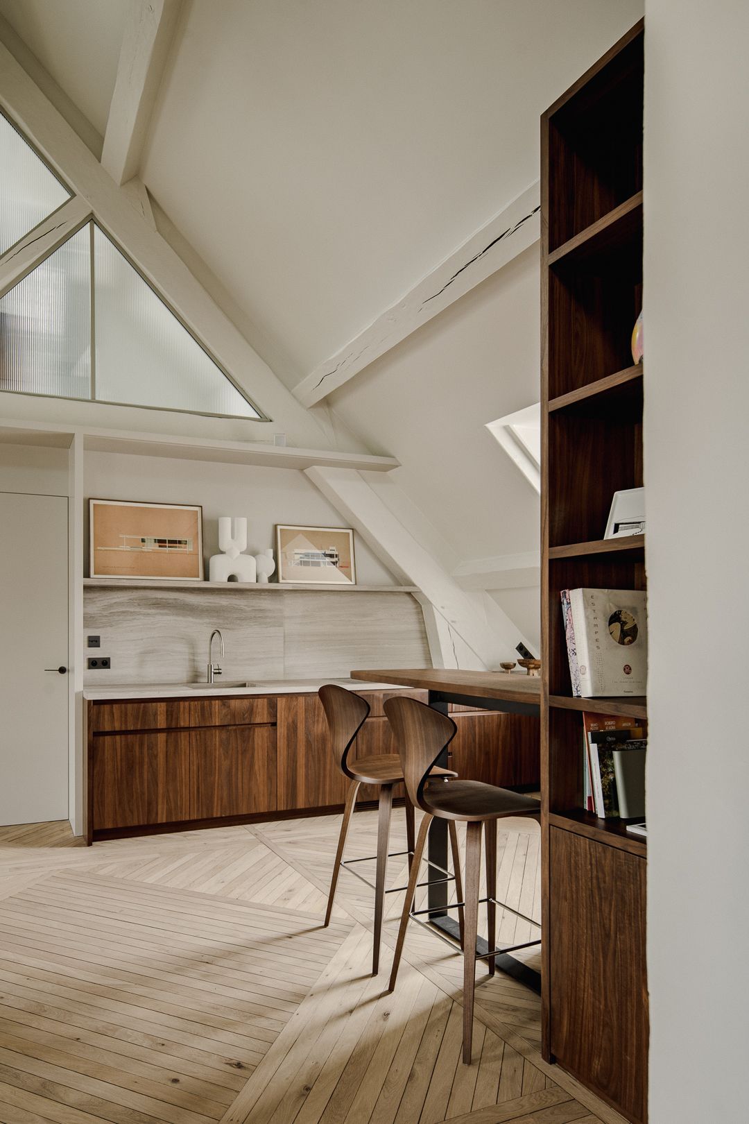 An attic in the Marais finds beauty in its constraints