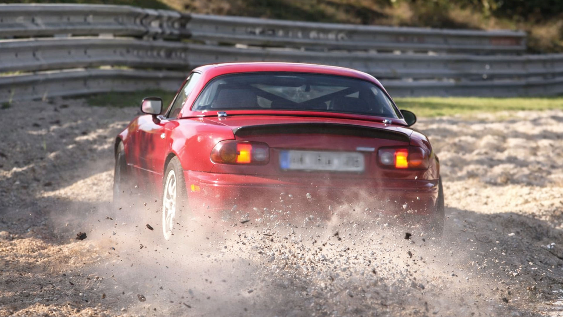 Gravel spray builds as car leaves Nürburgring line