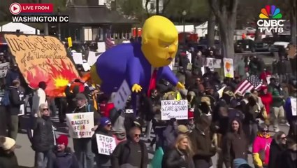 ‘No Kings’ protesters parade effigy of Trump defecating on US Constitution