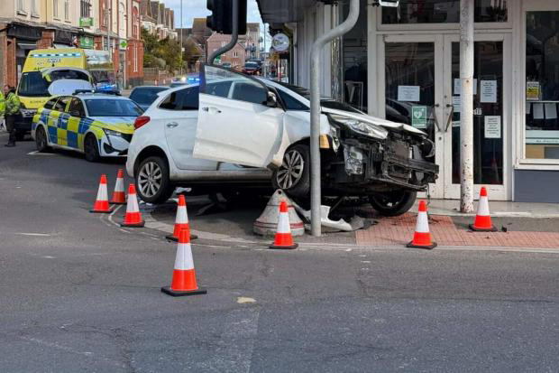 Three injured in three-vehicle crash as car collided with traffic lights