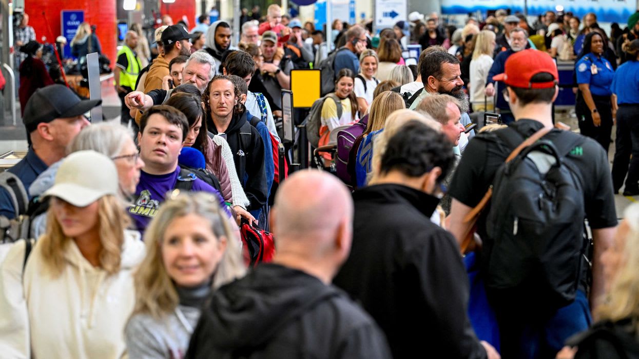 Passengers stand in line at Baltimore/Washington International Thurgood Marshall Airport (BWI), in Baltimore, Maryland, U.S., March 27, 2026. REUTERS/Daniel Heuer
