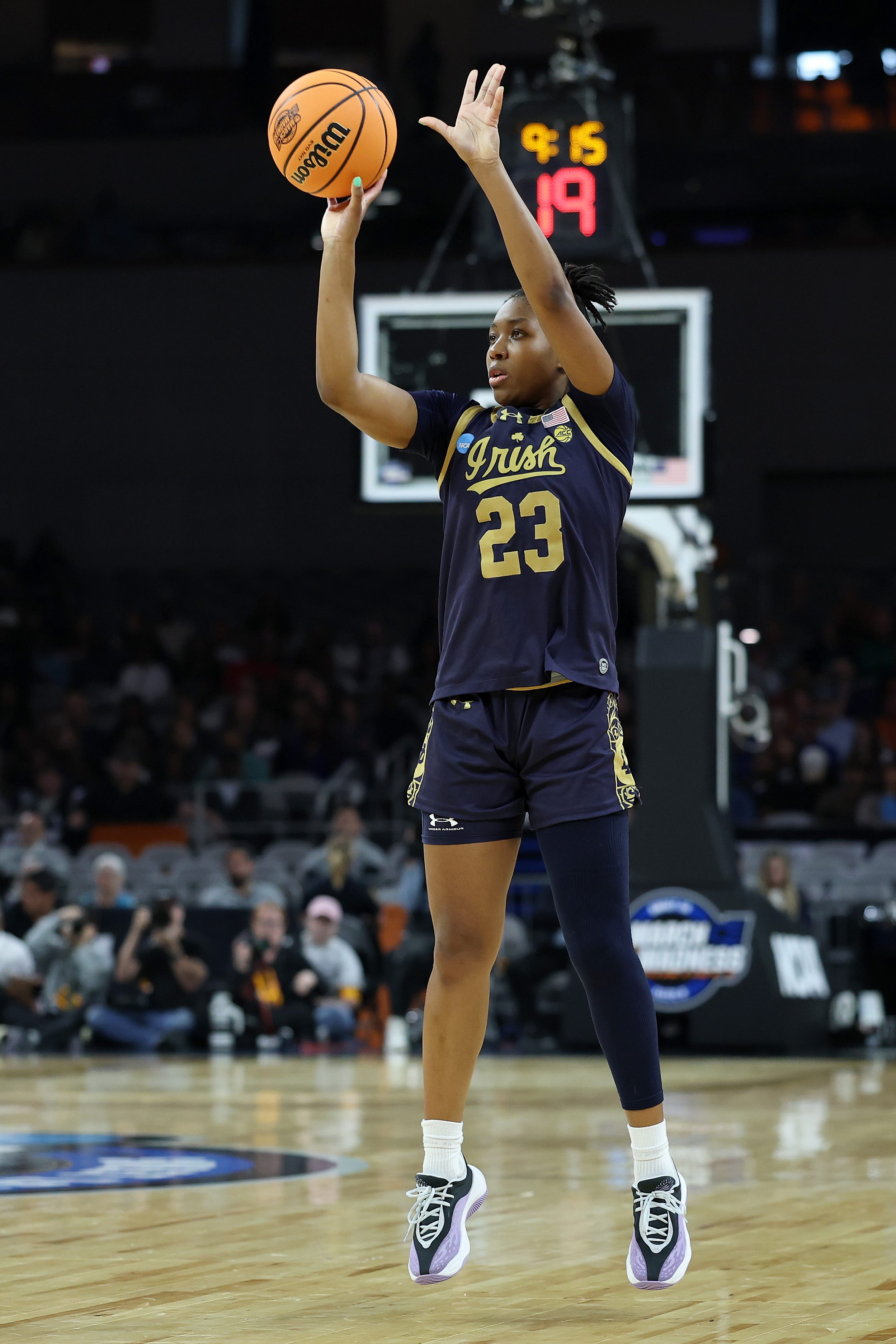 New baskets, rims and basketballs stunt shooting in women's March Madness