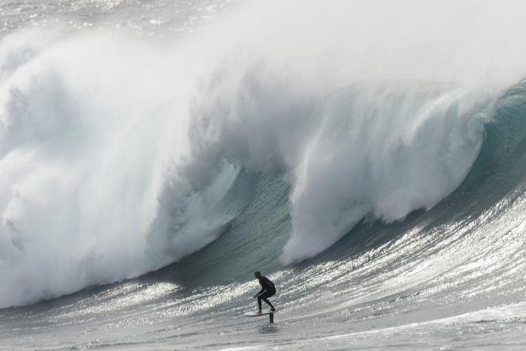 Daring rock fisher rescue as huge waves batter Sydney's beaches