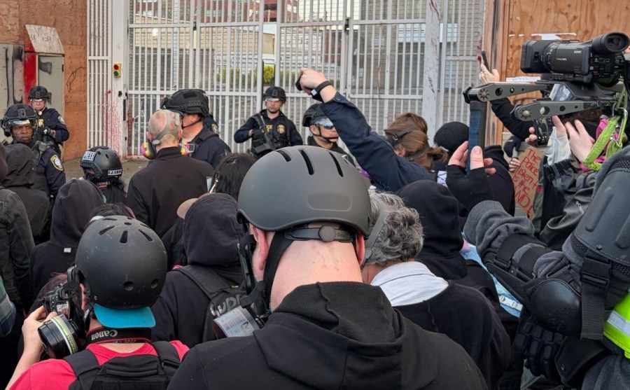 Police push back protesters from Portland ICE facility after crowd breaches front gate<br>