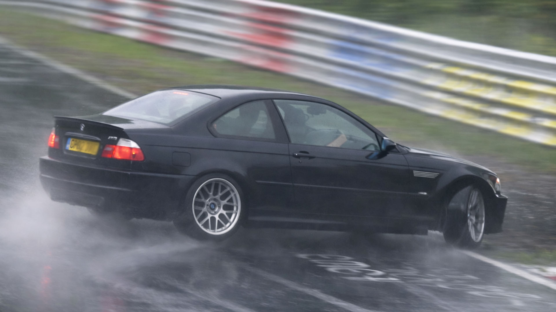 Wet surface makes car slide through Nürburgring turn