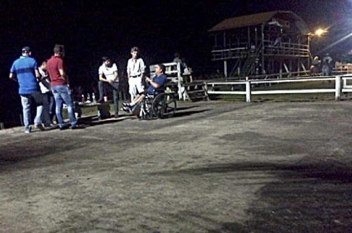 Franqui Francisco Flores de Freitas, in red shirt, and Efrain Antonio Campo Flores, with his leg raised, meet Honduran drug trafficker Amílcar Leva Cabrera.