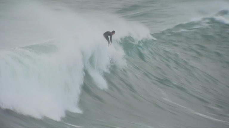 Daring rock fisher rescue as huge waves batter Sydney's beaches