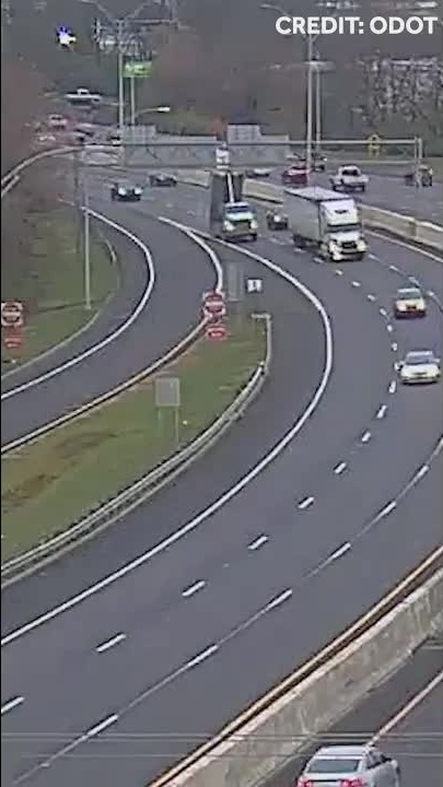 Dump truck bed up causes highway sign damage