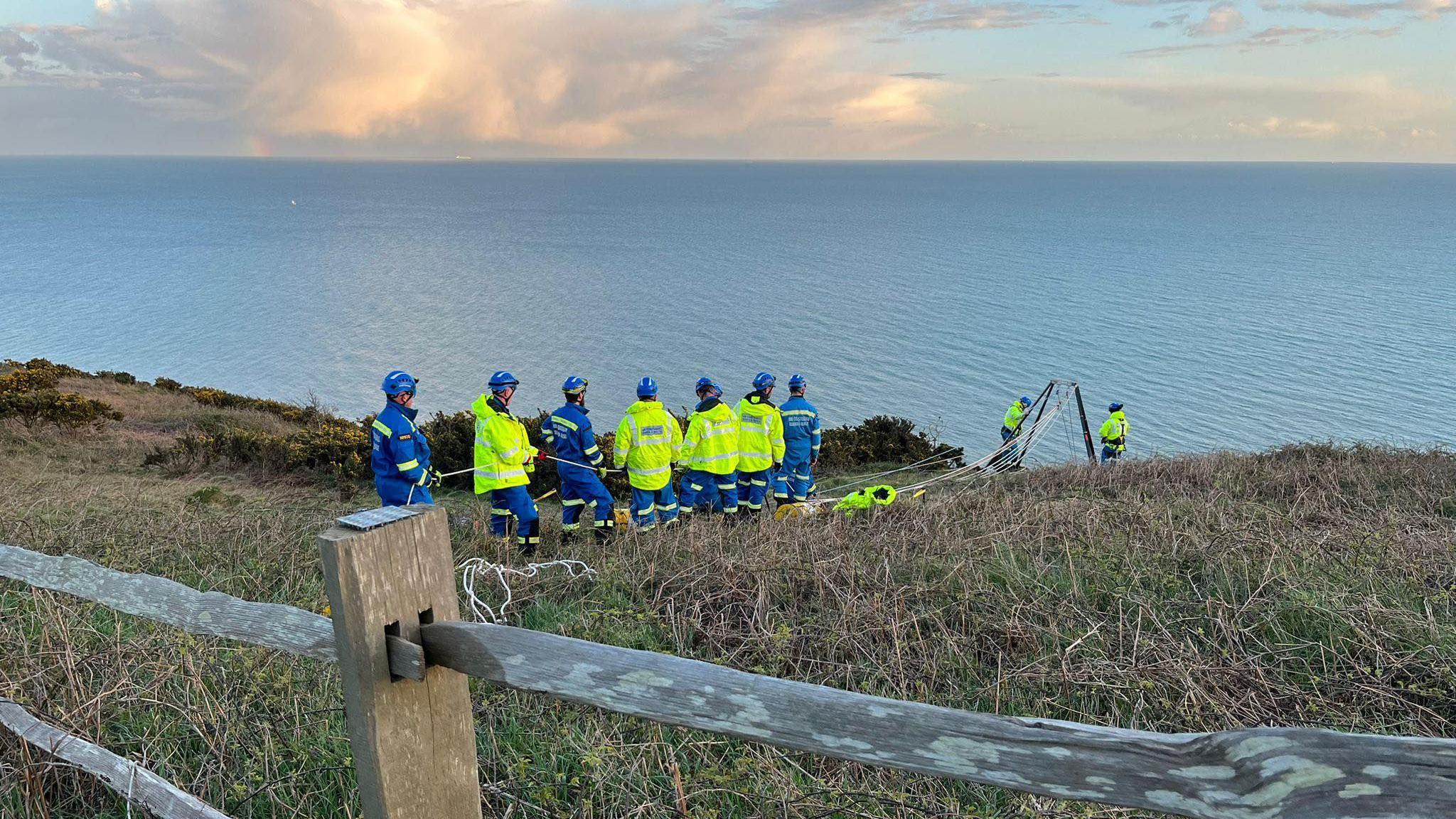 Three rescued from cliffs as light fades