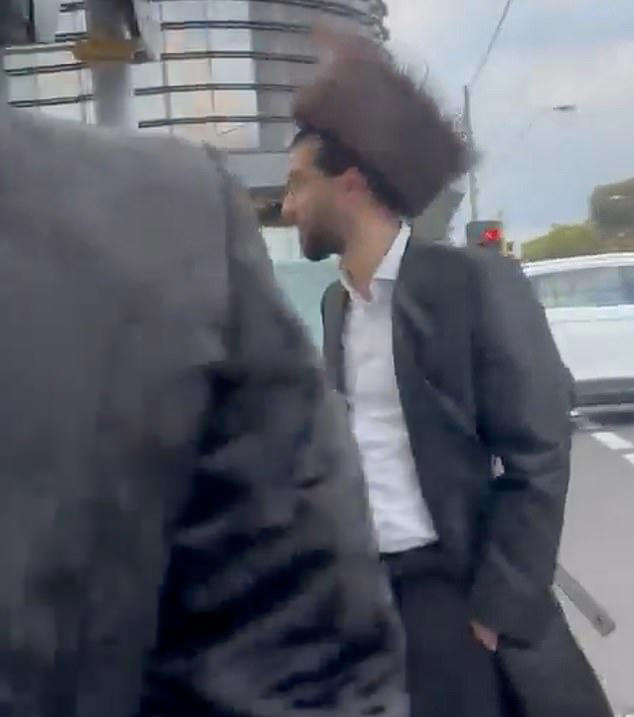 Shock scenes as women in 'stolen' car hurl eggs at pedestrians and yell ...