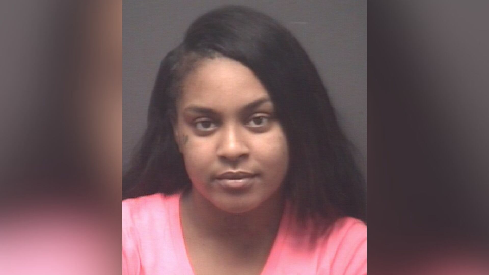 Greenville woman charged with pointing gun at crowd