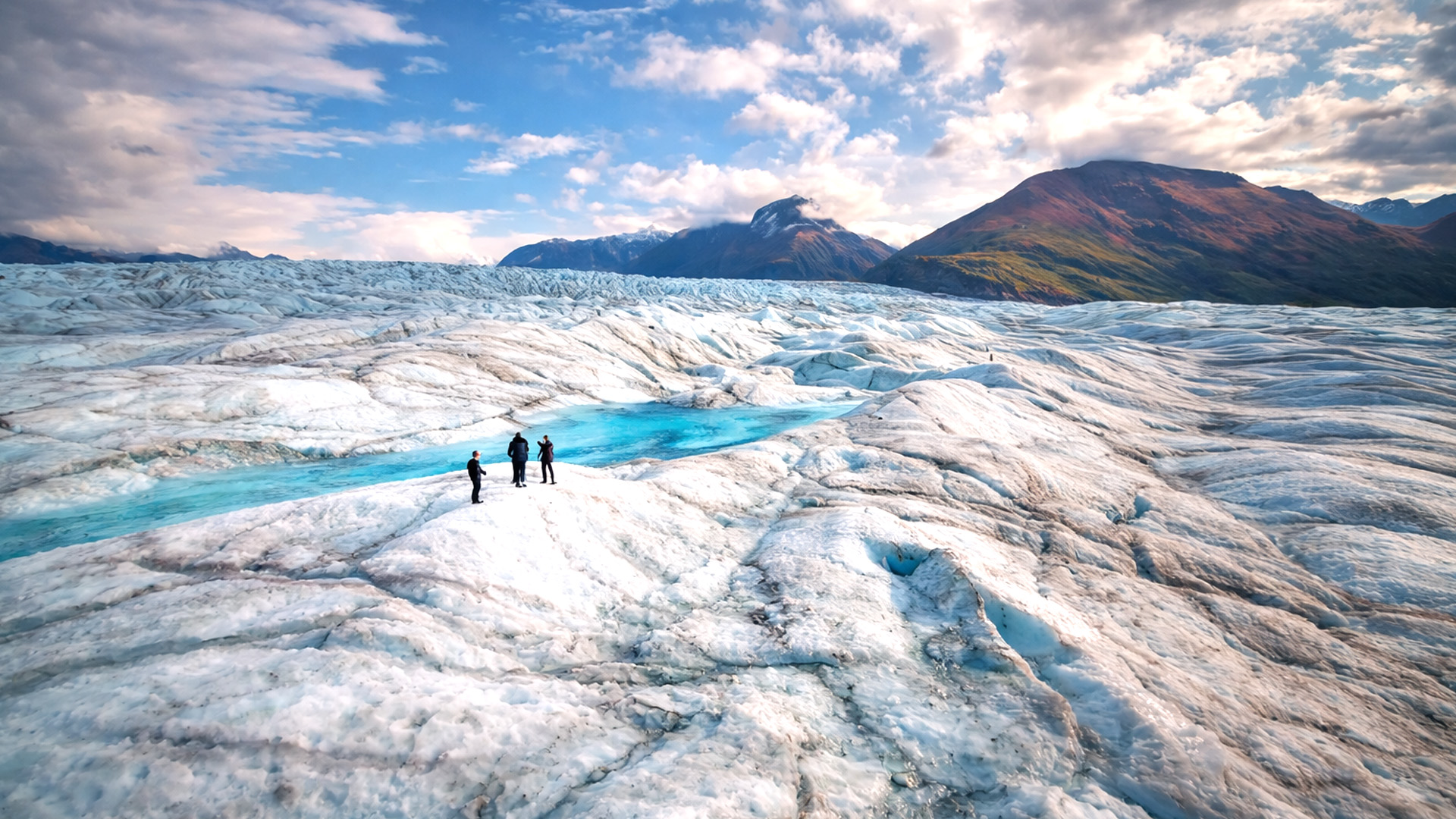 A vast glacier landscape in Alaska with ice and mountains