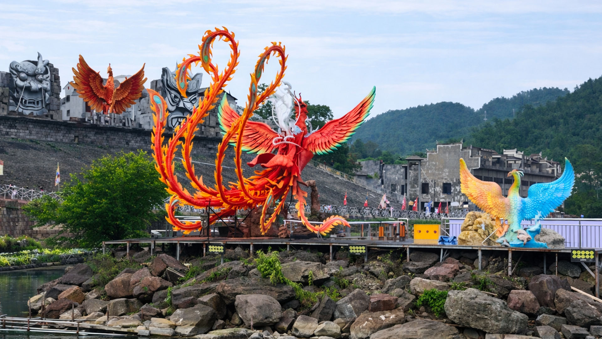 Bright phoenix figures appear along a riverside space in China