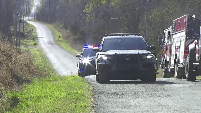 Police surround McLoud home after shots fired at vehicle