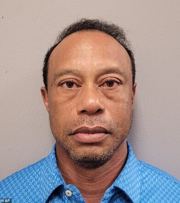 Tiger Woods stares down the lens in his police mugshot after being arrest for DUI on Friday