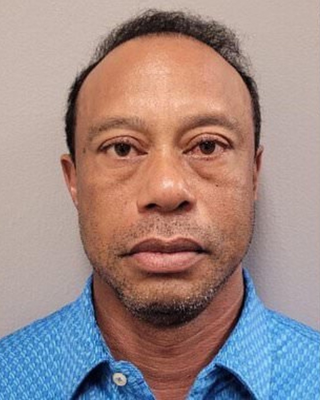 The blue polo Tiger Woods was wearing in his mugshot has sold out online following his arrest. Martin County Sheriffs Department / BACKGRID