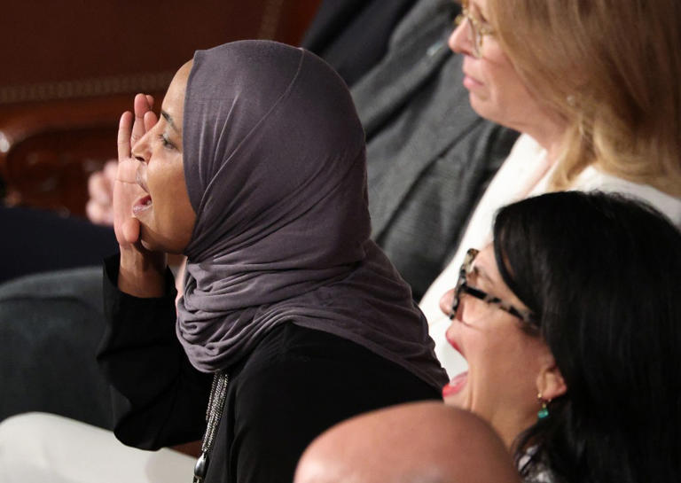 Representative Ilhan Omar, left, shouts during President Donald Trump’s State of the Union address during a joint session of Congress at the U.S. Capitol on February 24, 2026, in Washington.
