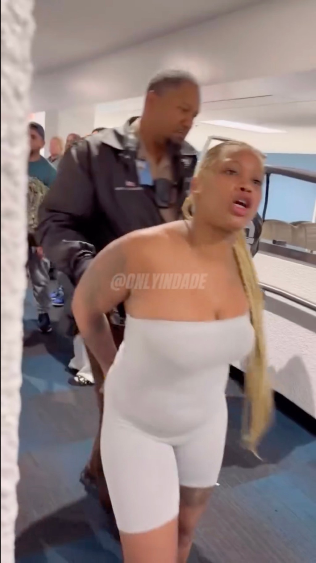 Davana Cochran, 26 was escorted out of Miami Intl. Airport and was captured twerking next to an officer. onlyindade/instagram