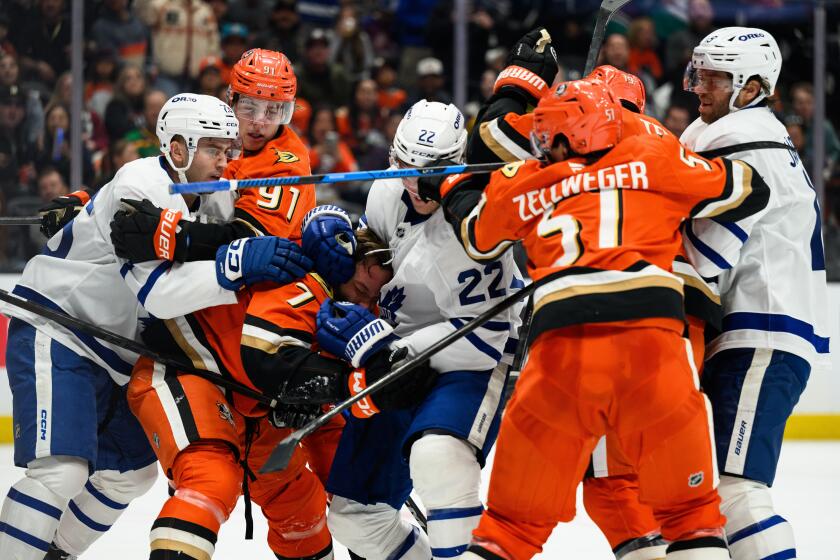 Ducks fall in overtime to revenge-minded Maple Leafs in fight-filled ...