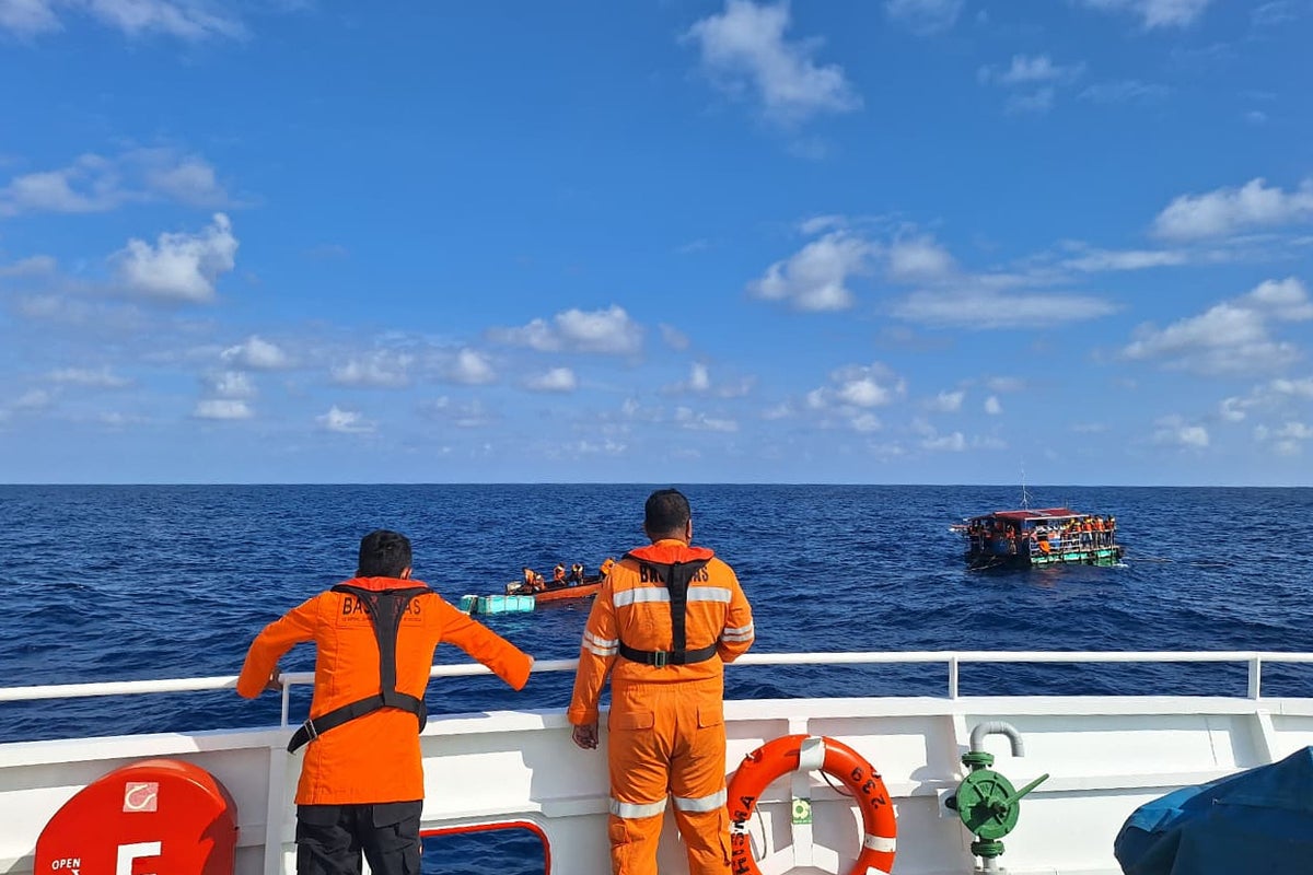 Rescue teams in race against time to find 27 people after boat sinks