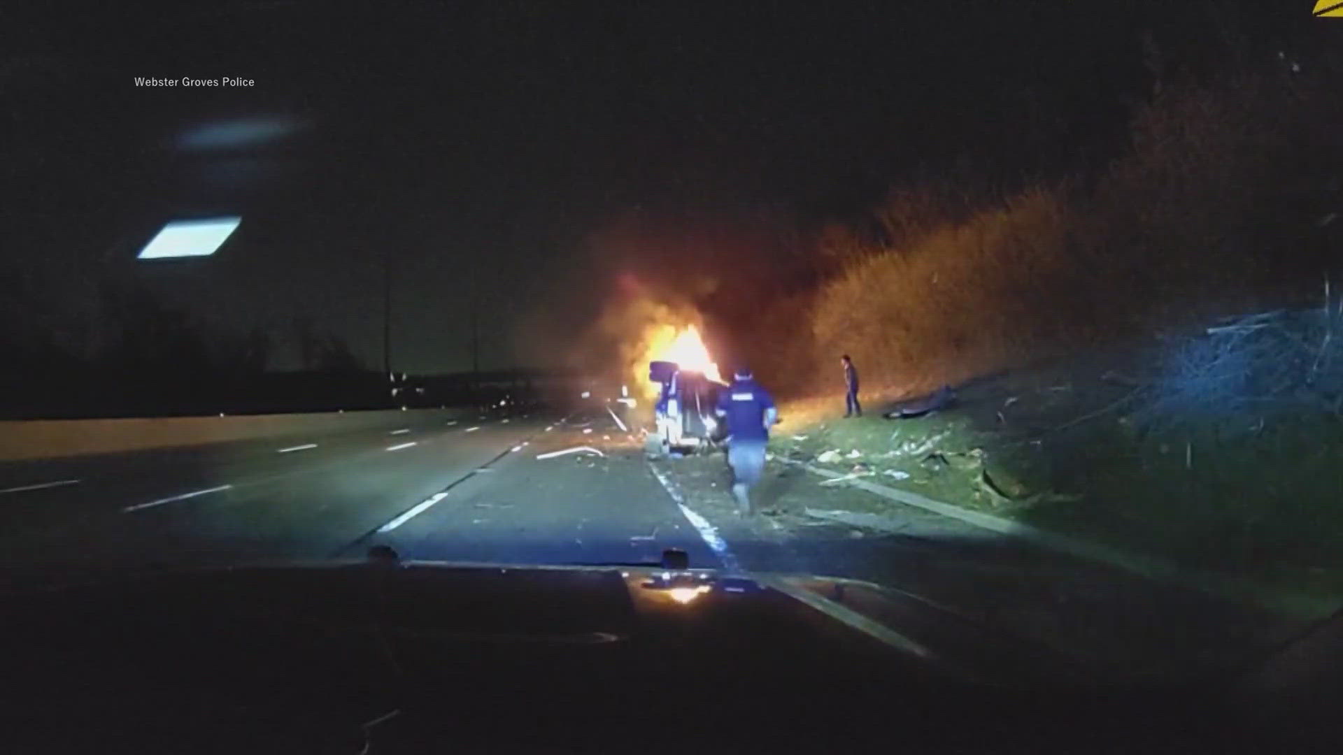 Police officers save a man from a burning car in Missouri