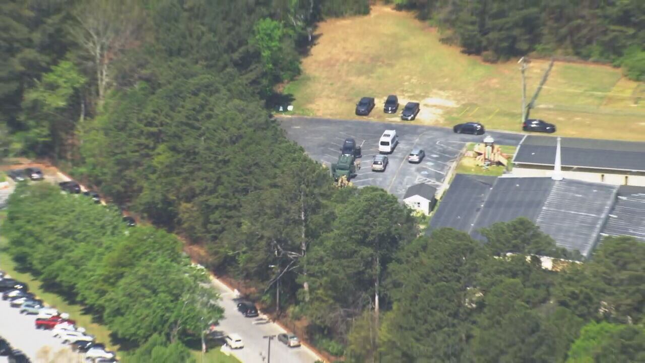 School lockdown lifted; officers search for 'dangerous fugitive' in ...
