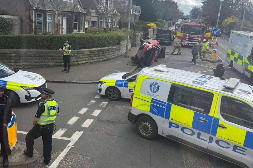 Edinburgh car flips on busy road as emergency services deploy and buses ...