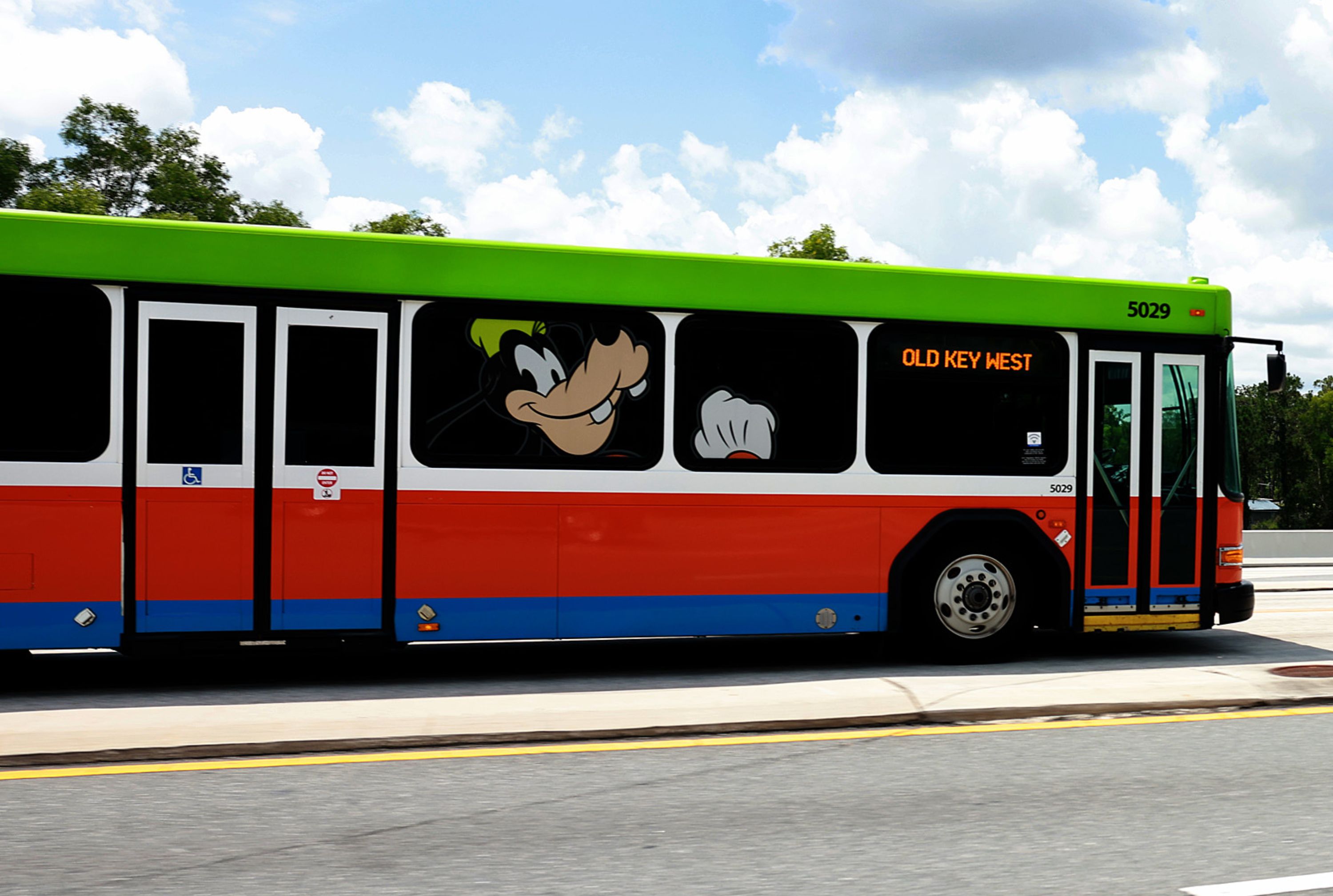 Car collides into Walt Disney World bus while attempting to beat a red ...