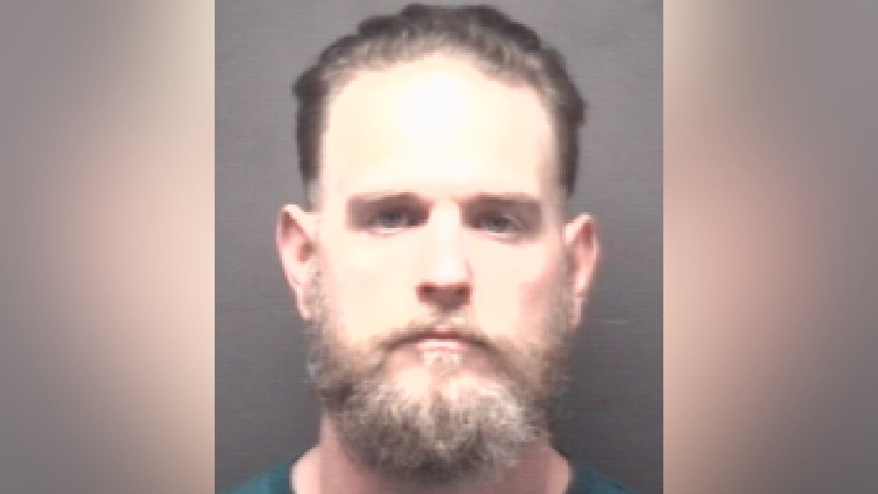 Greenville man accused of assaulting wife near underage boy