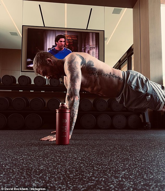 David Beckham shows off his ripped physique as he works out shirtless ...