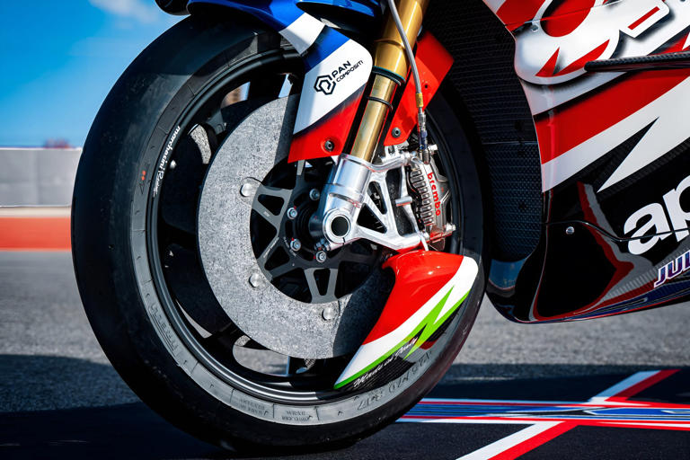 Those carbon discs and billet aluminum calipers define functional art.