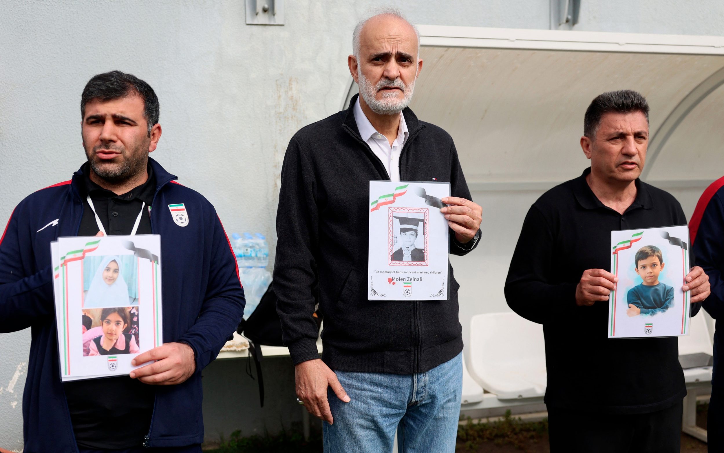 Iran’s head coach Amir Ghalenoei (left) and football federation vice-president Mahdi Mohammadnabi (centre) made the gesture as well as the players - Adem Altan/Getty Images