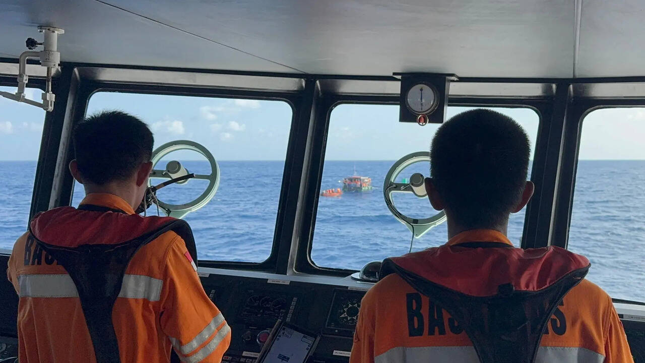Indonesian search teams rescue 21 people from raft after boat sinks
