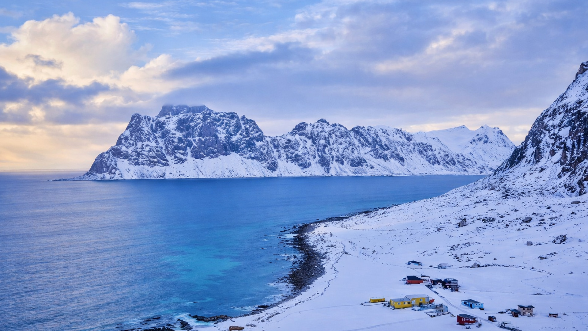 Lofoten Islands in Norway with snowy mountains by the sea