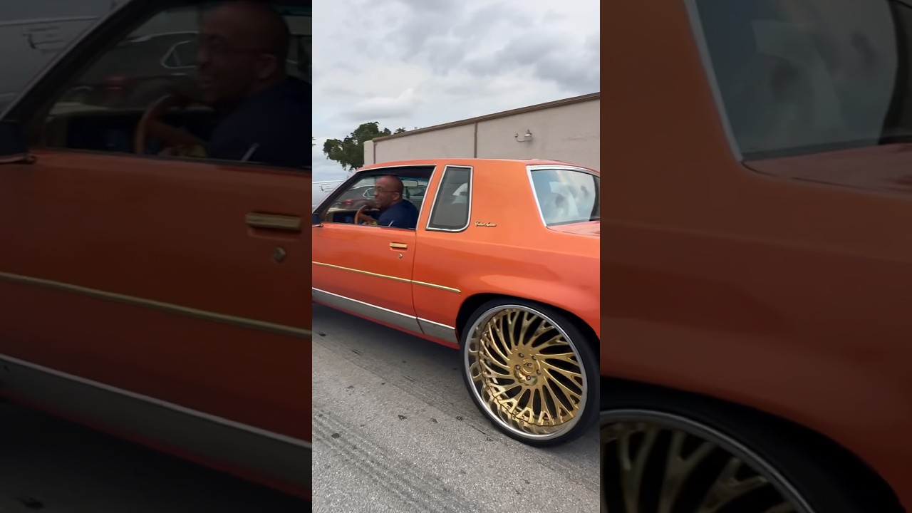 Bro cutting up in his Cutlass on gold 24’s