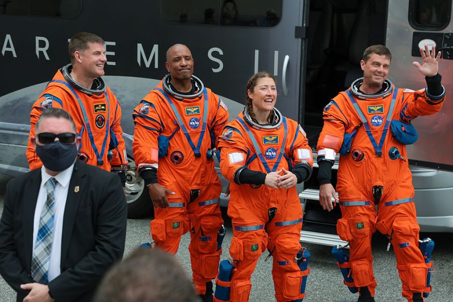 CAPE CANAVERAL, FLORIDA – APRIL 01: (L-R) Mission specialist Jeremy Hansen of CSA (Canadian Space Agency), pilot Victor Glover mission specialist Christina Koch and commander Reid Wiseman walk to an astronaut transfer van as they depart the Neil A. Armstrong Operations and Checkout Building ahead of the launch of the Artemis II at NASA’s Kennedy Space Center on April 01, 2026 in Cape Canaveral, Florida. The 322-foot-tall Artemis II Space Launch System rocket and Orion spacecraft will take the astronauts around the moon and back, 230,000 miles out into space and the farthest any human has ever traveled from Earth. (Photo by Joe Raedle/Getty Images)