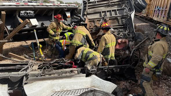 Semi truck hits train at Highway 80 in Midland